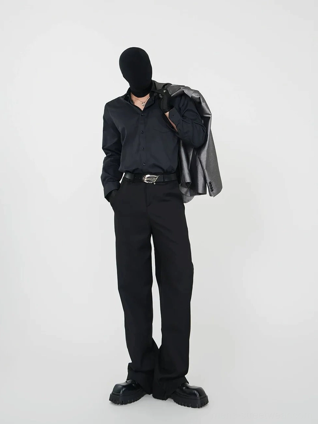 Black satin dress shirt styled with a blazer, leather belt, tailored trousers, and platform shoes for a polished evening look