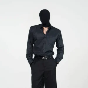 Black satin dress shirt with long sleeves, chest pocket, structured collar, and button front styled with black tailored trousers