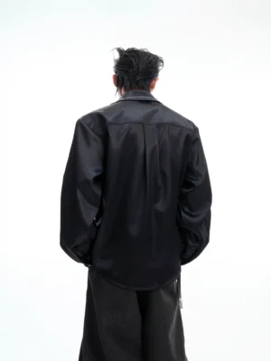 Black satin oversized party shirt for men shown from the back with relaxed streetwear fit and classic back yoke