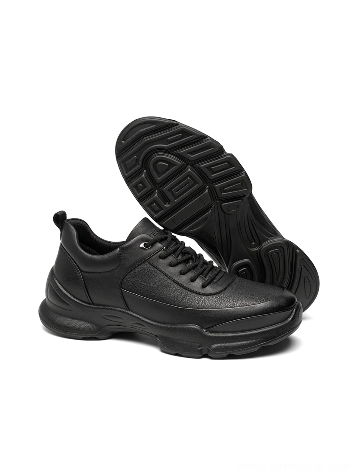 Dynamic studio view of black sculpted sole chunky sneakers displaying outsole tread and layered upper construction