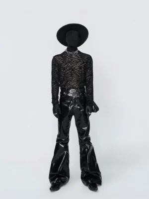 Black sheer zebra burnout turtleneck styled with patent leather flared pants in a dark streetwear front full-body look
