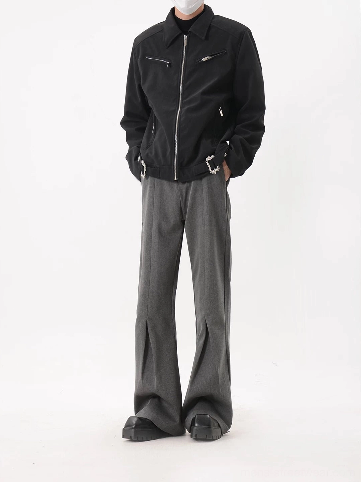 Black short moto jacket with structured cropped fit silver hardware and multiple utility pockets for modern Seoul streetwear