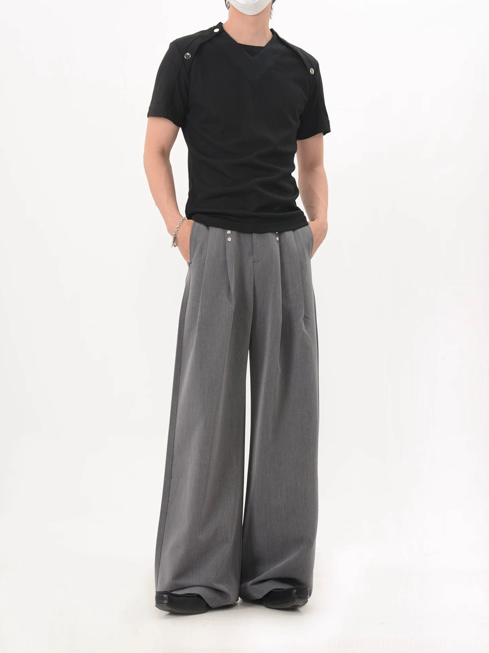 Black fitted shoulder snap knit tee full front view with crew neckline, subtle knit texture, and streamlined Korean streetwear silhouette