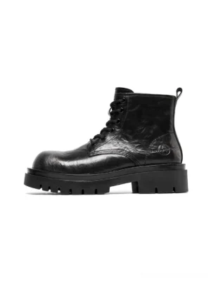 Black side-zip lace-up platform lug sole combat boots shown in left side profile on a white studio background