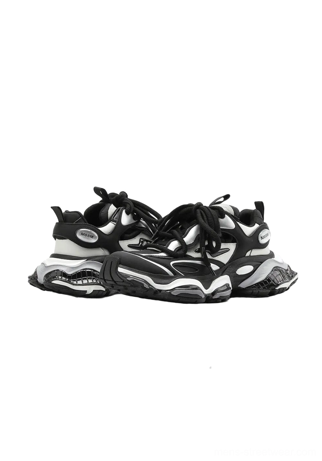Pair of black and silver chunky air-cushioned runner sneakers shown from a top-down three-quarter angle with layered upper panels and anti-slip rubber outsole