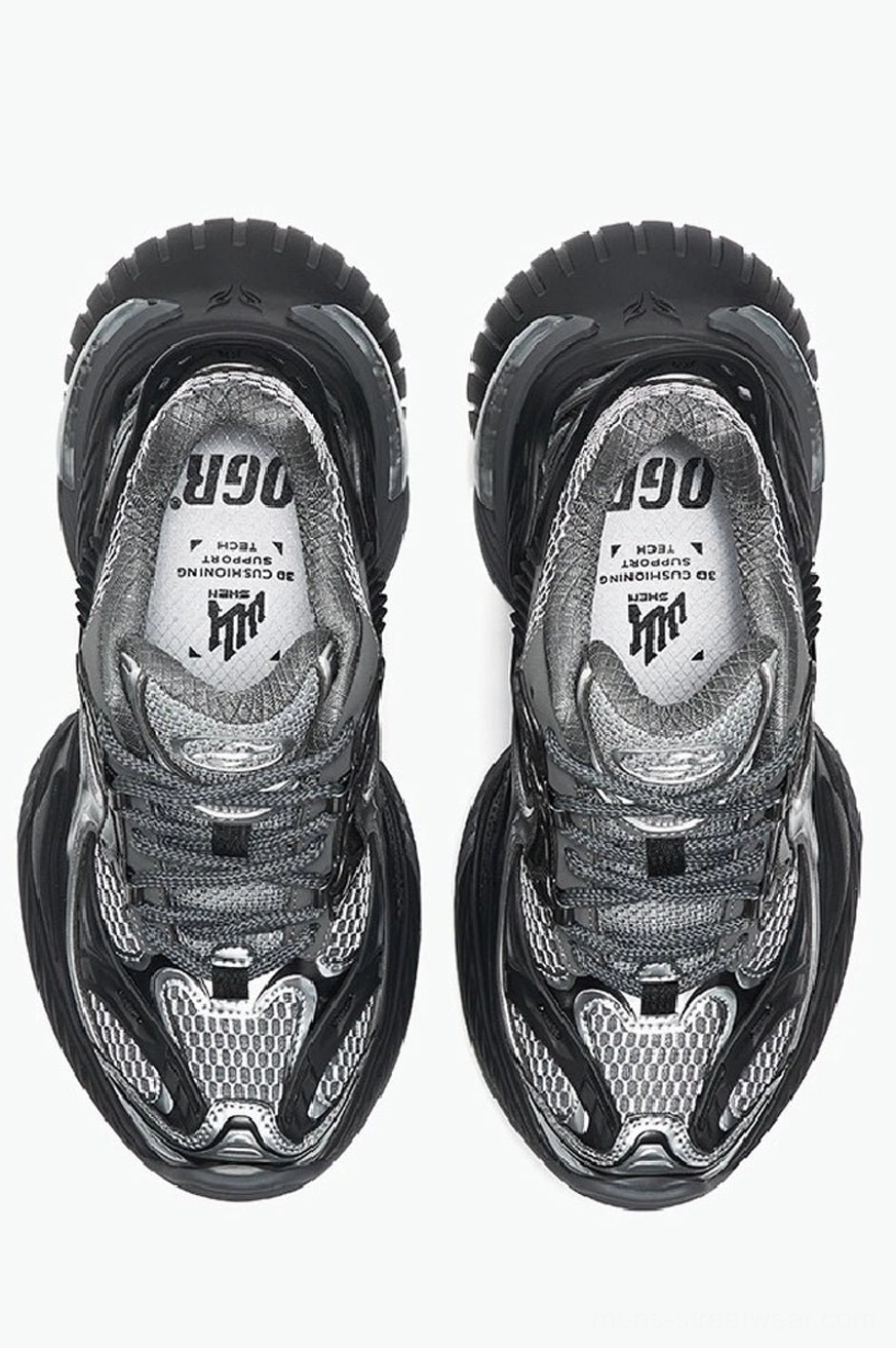 Top-down view of black and silver chunky platform sneakers showing mesh uppers, metallic toe caps, and branded-style insoles