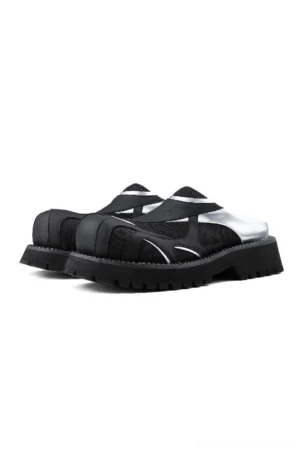 Front view of black and silver mesh platform slip-on mules with metallic accents and chunky black lug sole