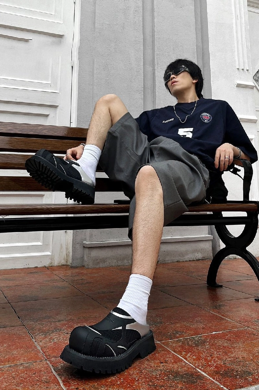 Full-body street style outfit featuring black and silver mesh platform slip-ons with a bold Y2K chunky silhouette
