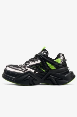 Black chunky techwear sneaker with silver mesh overlays neon green accents and futuristic geometric outsole side view