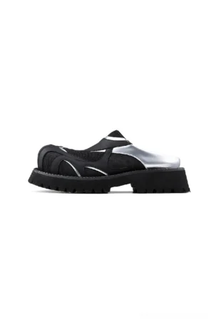 Side three-quarter view of black silver platform slip-on shoes with breathable mesh panels and thick lug outsole
