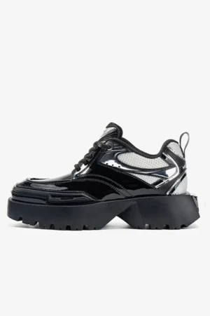 Side profile of black and silver square-toe chunky platform sneaker with glossy patent leather panels mesh upper and thick lug outsole