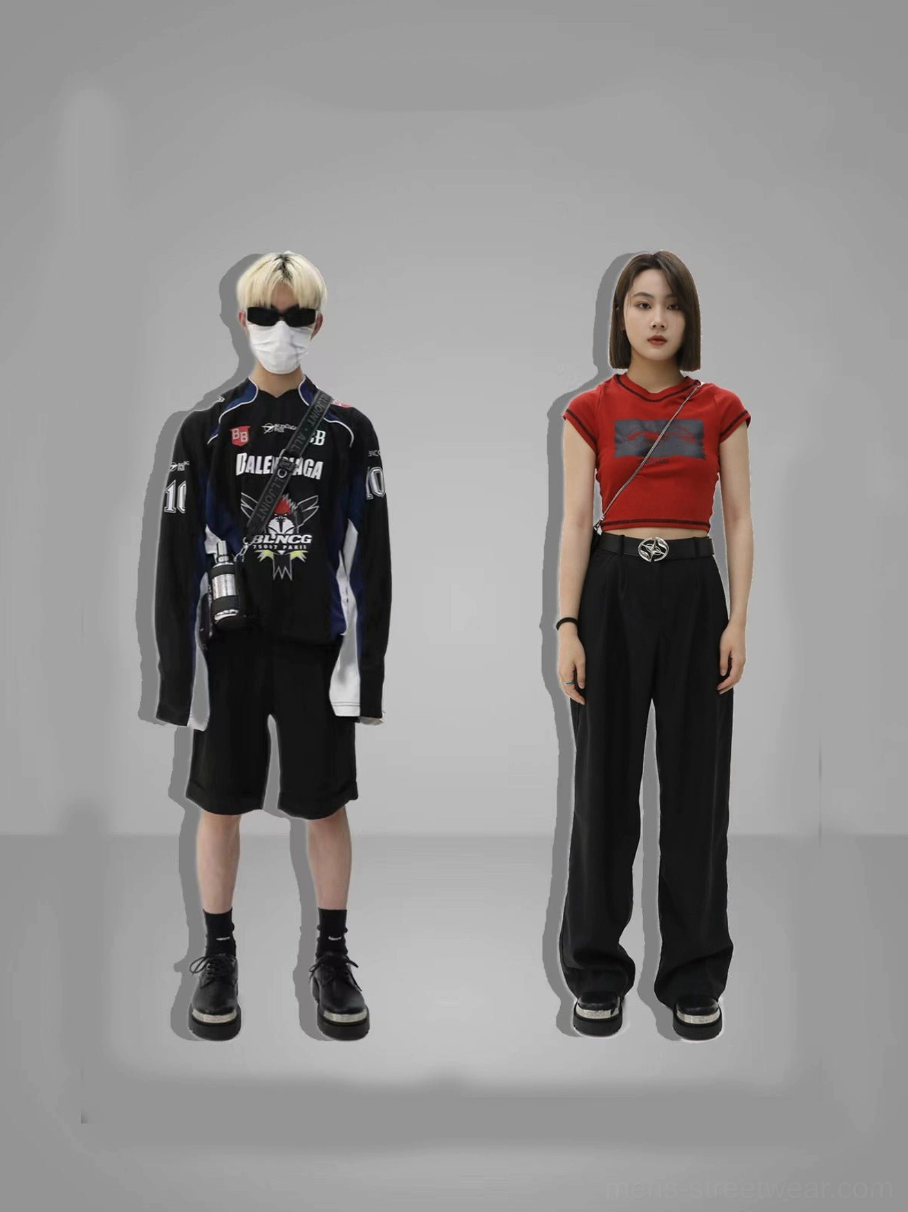 Male and female streetwear models wearing black silver-toe platform derby shoes with racing jacket, cropped top, and wide-leg trousers