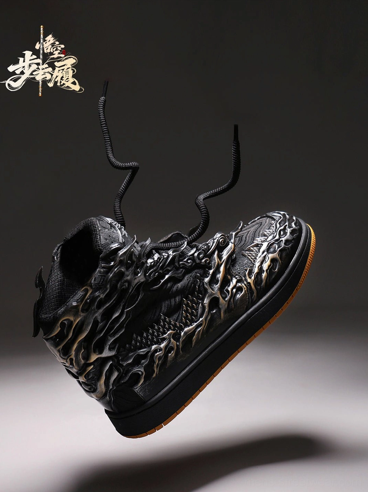 Low three-quarter rear view of black silver Wukong high-top sneakers showing laces heel relief texture and rubber outsole