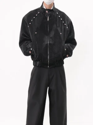 Black snakeskin studded cropped zip-up bomber jacket front view styled with black wide-leg pants