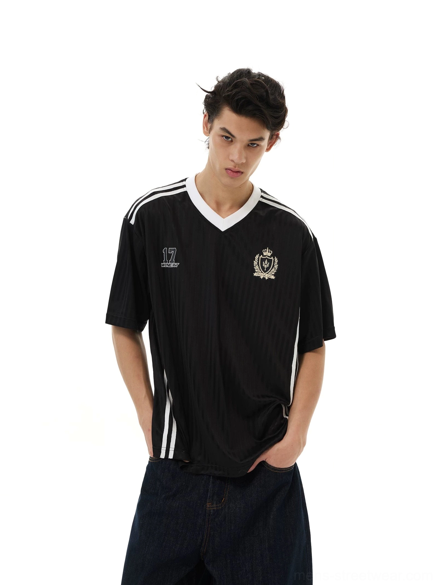 Black soccer jersey streetwear tee with crest emblem, number 17 chest graphic, contrast shoulder stripes, and relaxed fit