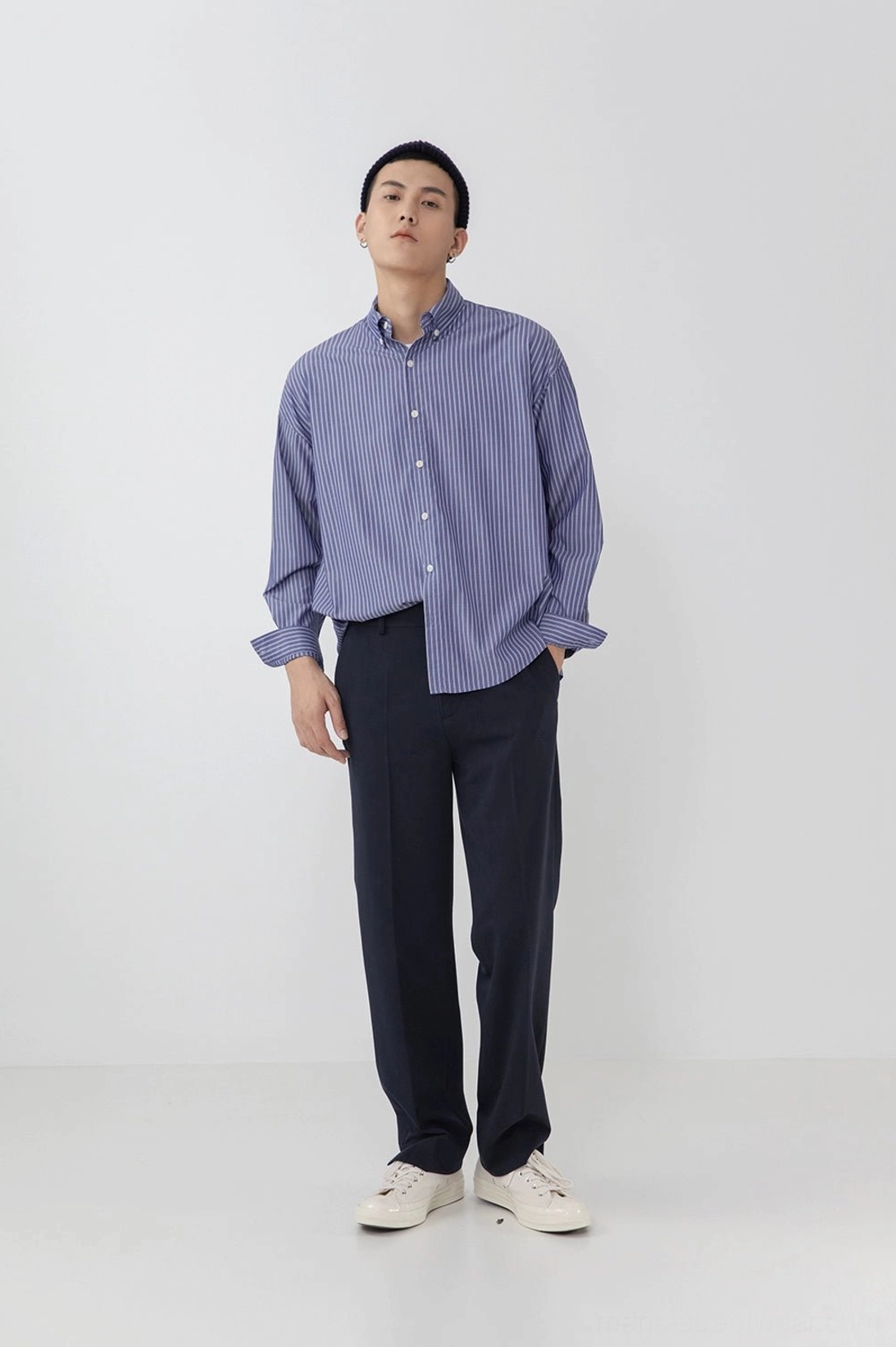 Black split hem pants contemporary streetwear styling full body view