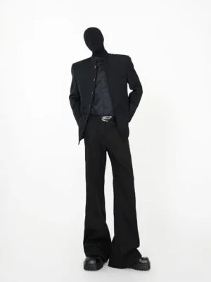 Full front view of black stand collar blazer with button closure styled with black flared trousers and platform shoes in Seoul-inspired mens streetwear