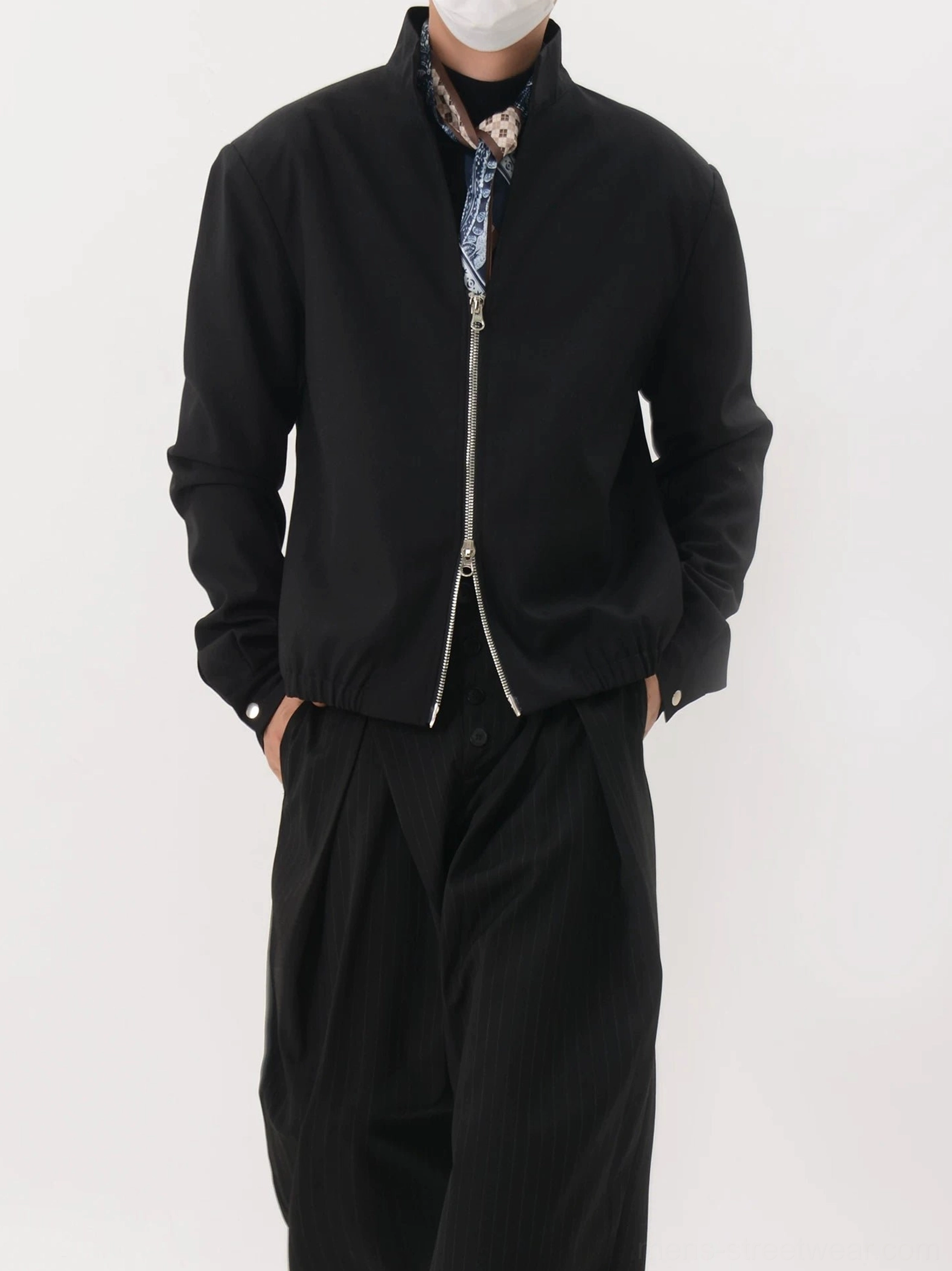 Black stand collar zip-up blouson jacket front three-quarter view with side pockets and tailored relaxed fit