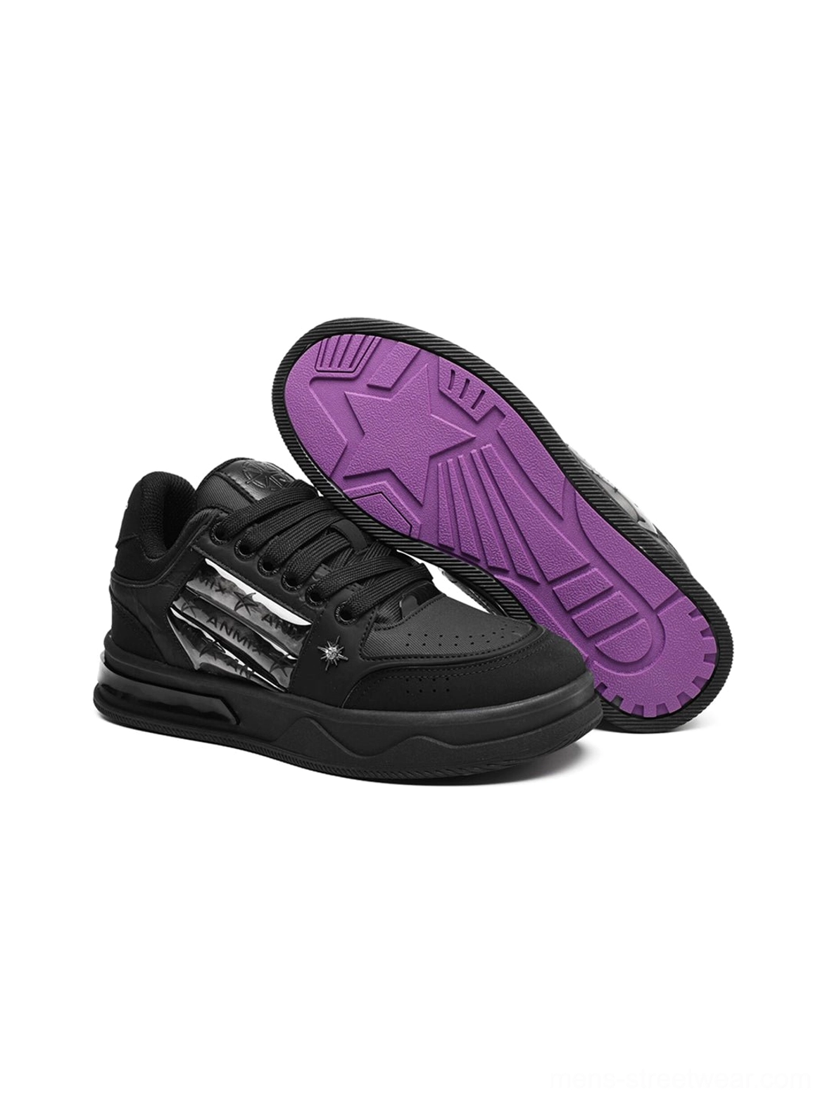 Black star studded gothic platform sneakers with silver striped side details and versatile low-top skate silhouette
