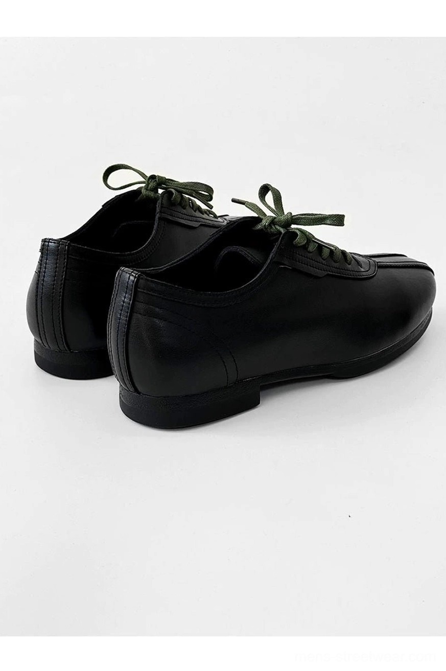Black streetwear derby shoes with split toe seam, green contrast laces, comfortable PU lining, and durable rubber outsole