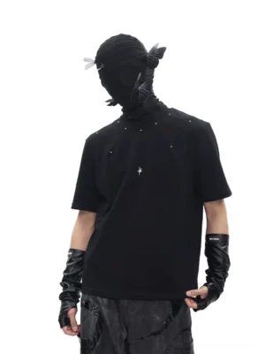 Black studded cross pendant T-shirt styled with leather gloves patent trousers and dark Korean streetwear accessories front view