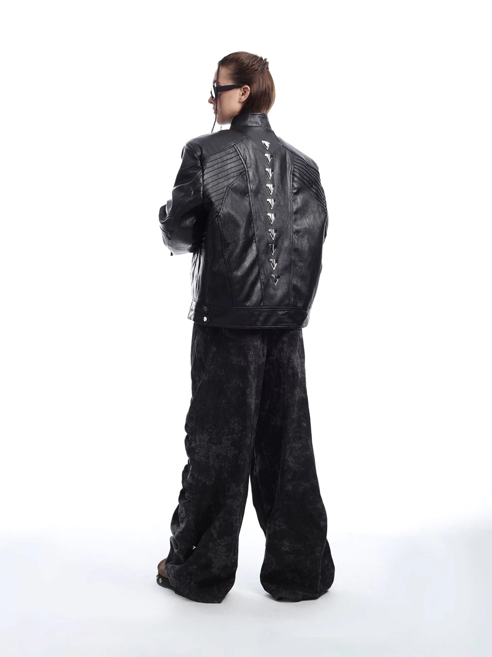 Black studded faux leather moto jacket rear view with cyberpunk spine hardware and quilted back shoulders
