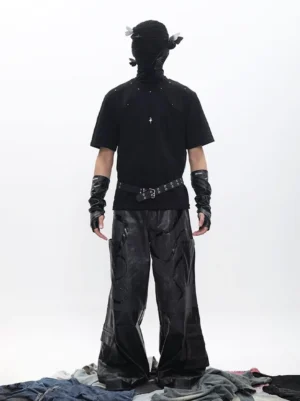 Back view of black studded pendant streetwear T-shirt showing subtle silver studs and cross accent with leather accessories