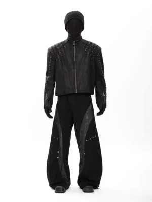 Black studded rider jacket with silver shoulder rivets stand collar and front zipper styled in dark Korean streetwear full front view