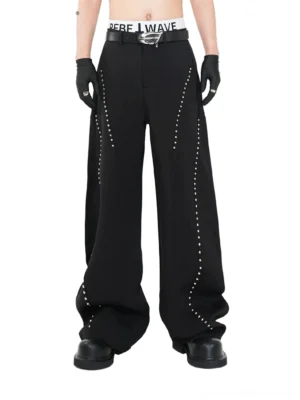 Black studded ultra wide leg streetwear trousers front full body view with silver curved rivet details