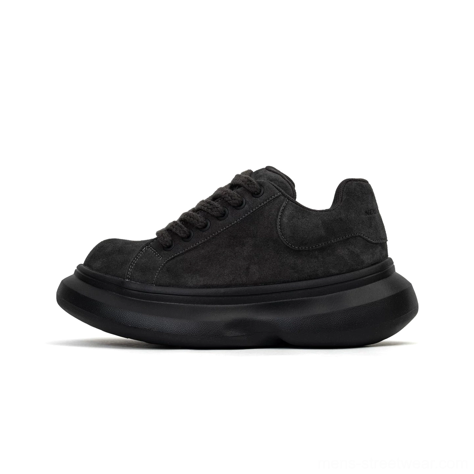 Black suede chunky platform sneaker shown in side view with matte upper, thick outsole, low-top shape, and minimalist Korean streetwear styling