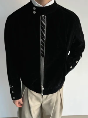 Black suede-look stand collar zip jacket styled with white shirt and striped tie for smart streetwear