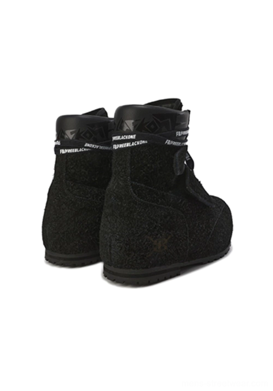 Rear three-quarter view of black suede platform winter boots with padded ankle collars, rear pull tabs, strap details, matte suede-textured finish, and rounded block sole