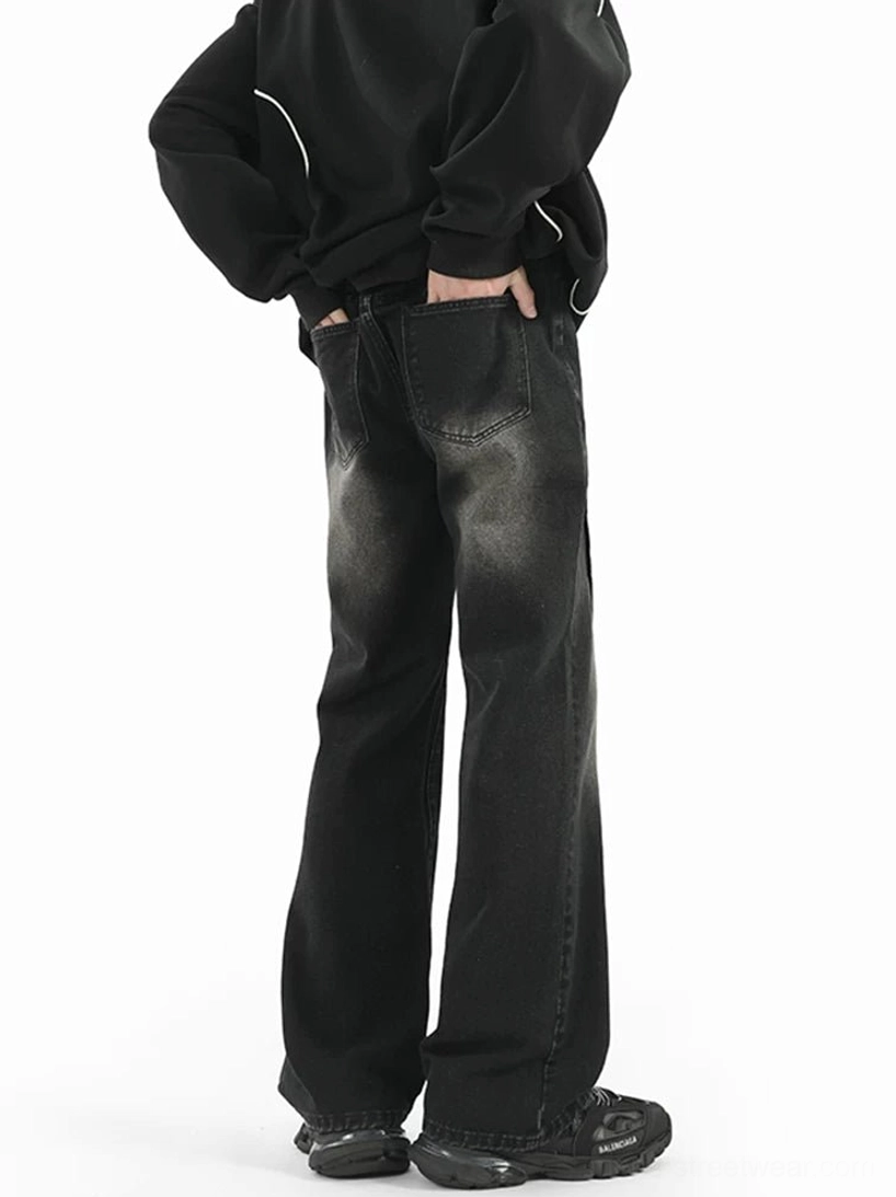 Rear side view of Black Sunfade Arc Flare Jeans with classic back pockets and washed wide-leg denim silhouette