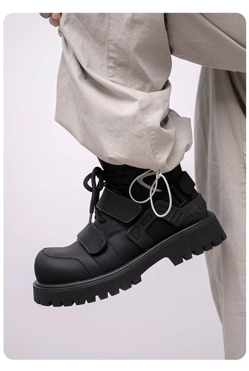 Lifted black tactical streetwear boot showing lace loops, adjustable hook-and-loop straps, padded upper construction, and full lug outsole tread