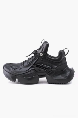 Side view of black tactical hiking sneakers featuring a thick serrated platform sole, lace-up fastening, structured panels, and rear pull tab