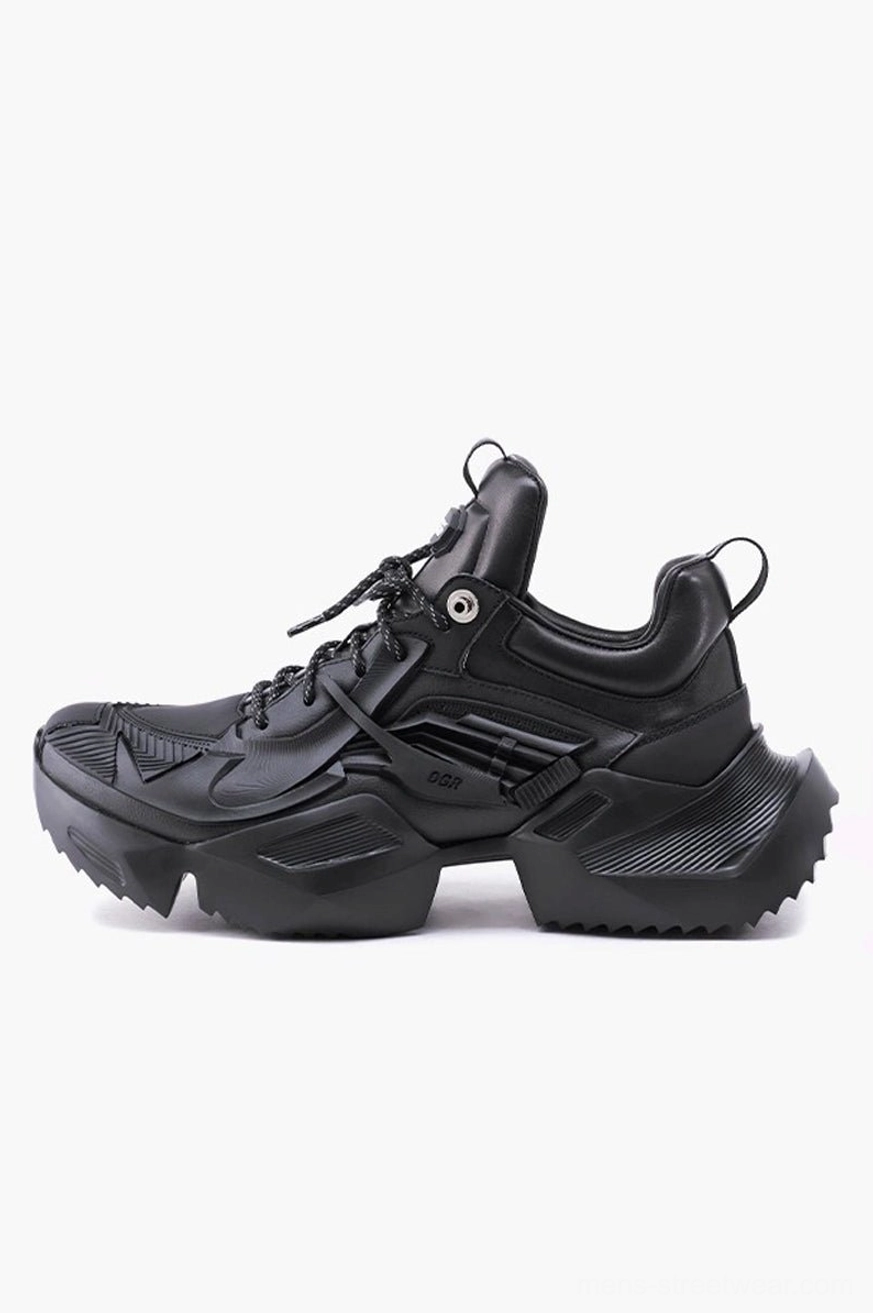 Side view of black tactical hiking sneakers featuring a thick serrated platform sole, lace-up fastening, structured panels, and rear pull tab