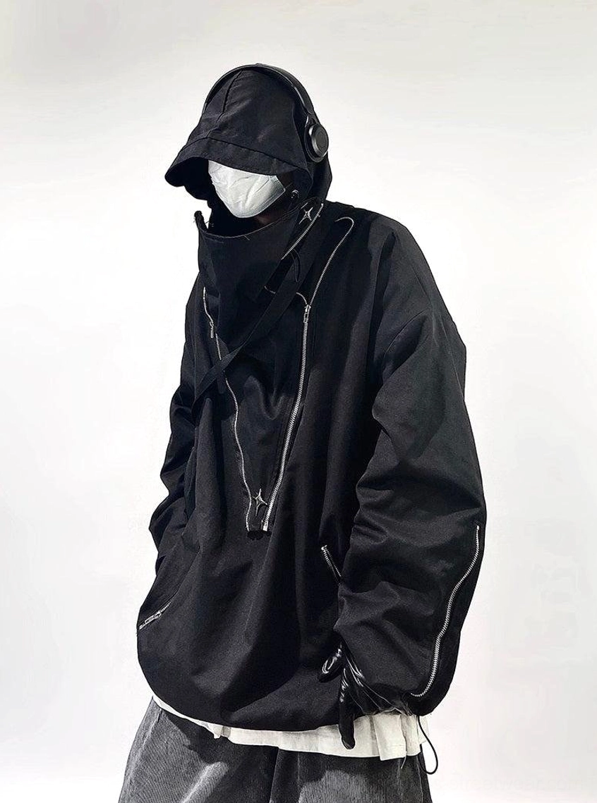 Black oversized tactical hooded pullover jacket shown from the rear three-quarter angle with concealed high neck zipper and adjustable hood