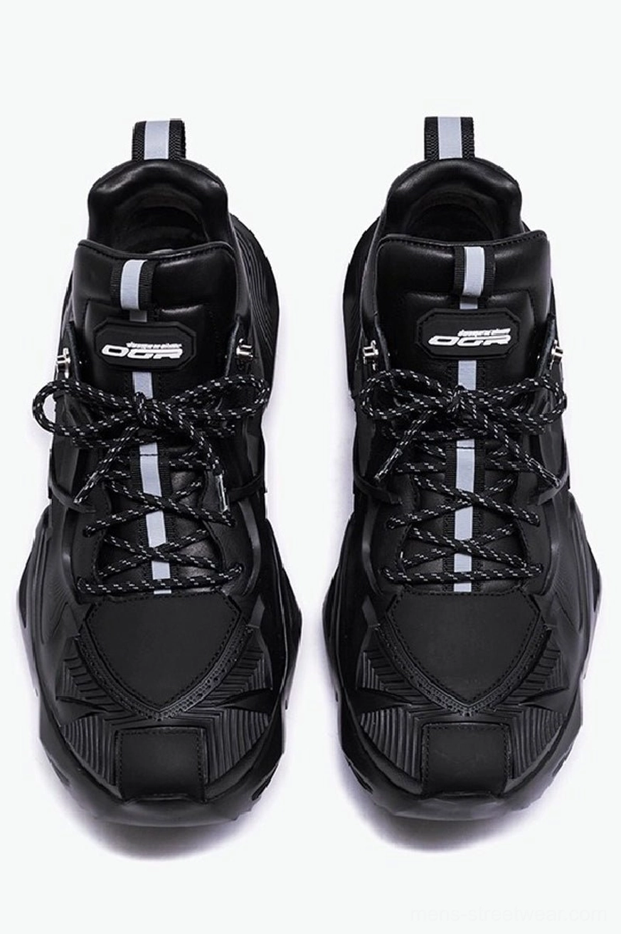 Top front view of black tactical platform hiking sneakers with white tongue stripe, reflective laces, and reinforced paneled toe cap