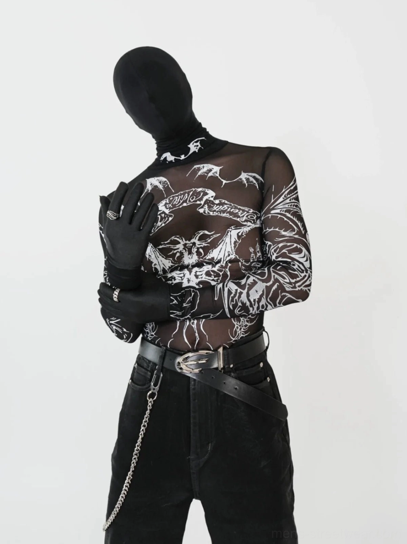 Close three-quarter view of black tattoo mesh turtleneck top with white gothic arm and torso graphics and fitted silhouette