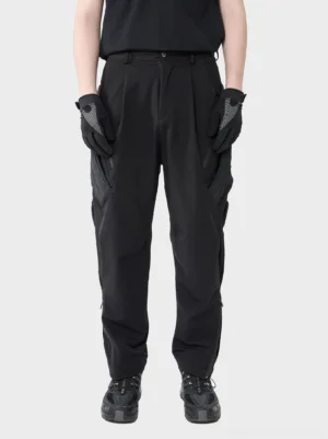 Black techwear tactical cargo pants front full body view with relaxed tapered fit and utility pockets
