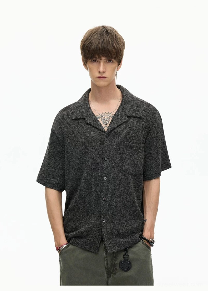 Black textured camp collar shirt full upper-body view with front buttons, chest patch pocket, and relaxed Korean fashion fit