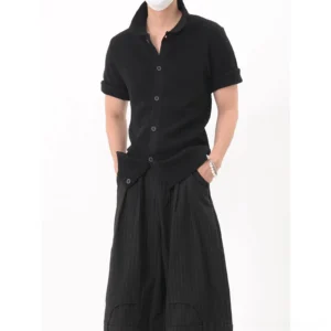 Black textured short-sleeve polo shirt with structured collar, full button placket, tailored fit, and modern Korean streetwear styling