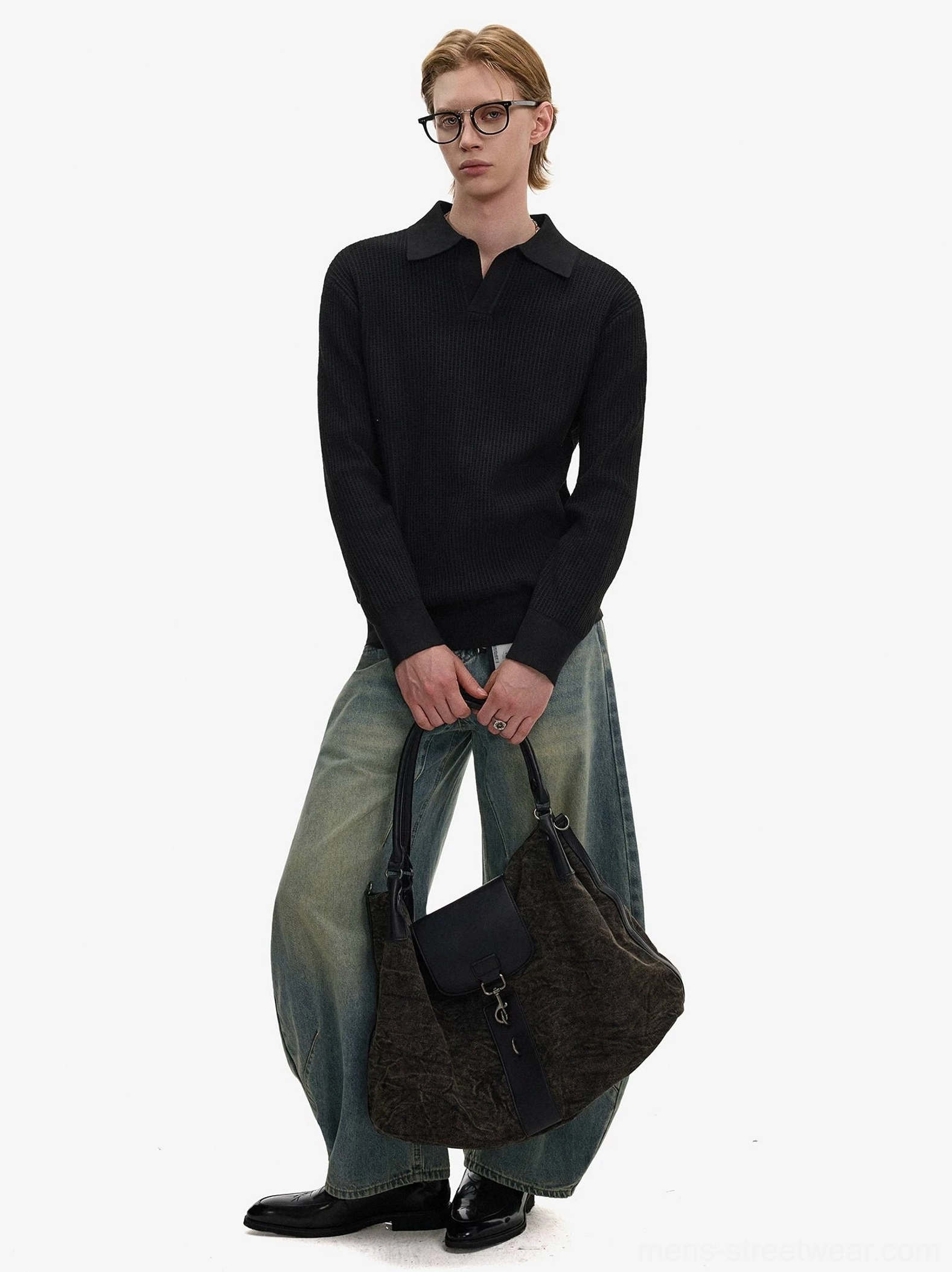 Black textured waffle knit open collar polo sweater with wide-leg jeans leather shoes and tote bag in minimalist mens streetwear styling