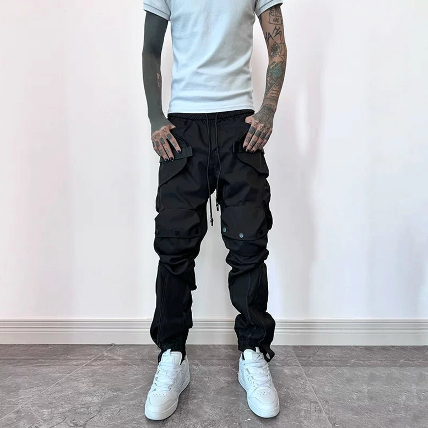 Black thick style techwear cargo joggers with multi-pocket construction, adjustable hems and tactical streetwear fit