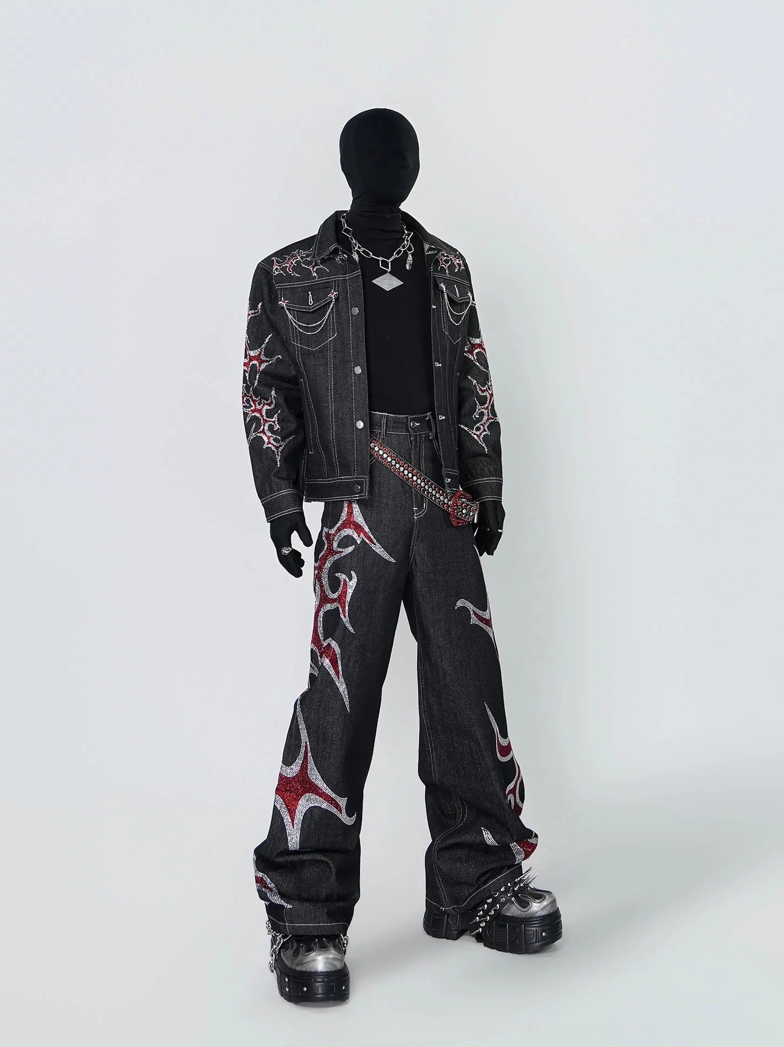 Right side view of black tribal flame denim jacket with silver red embroidery and chain detailed streetwear styling