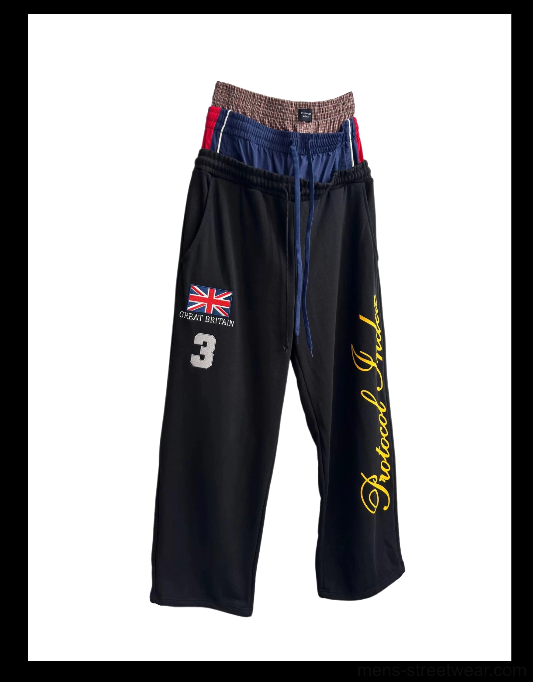 Black triple waist track flares product flat lay with stacked elastic waistband wide leg shape and streetwear graphics
