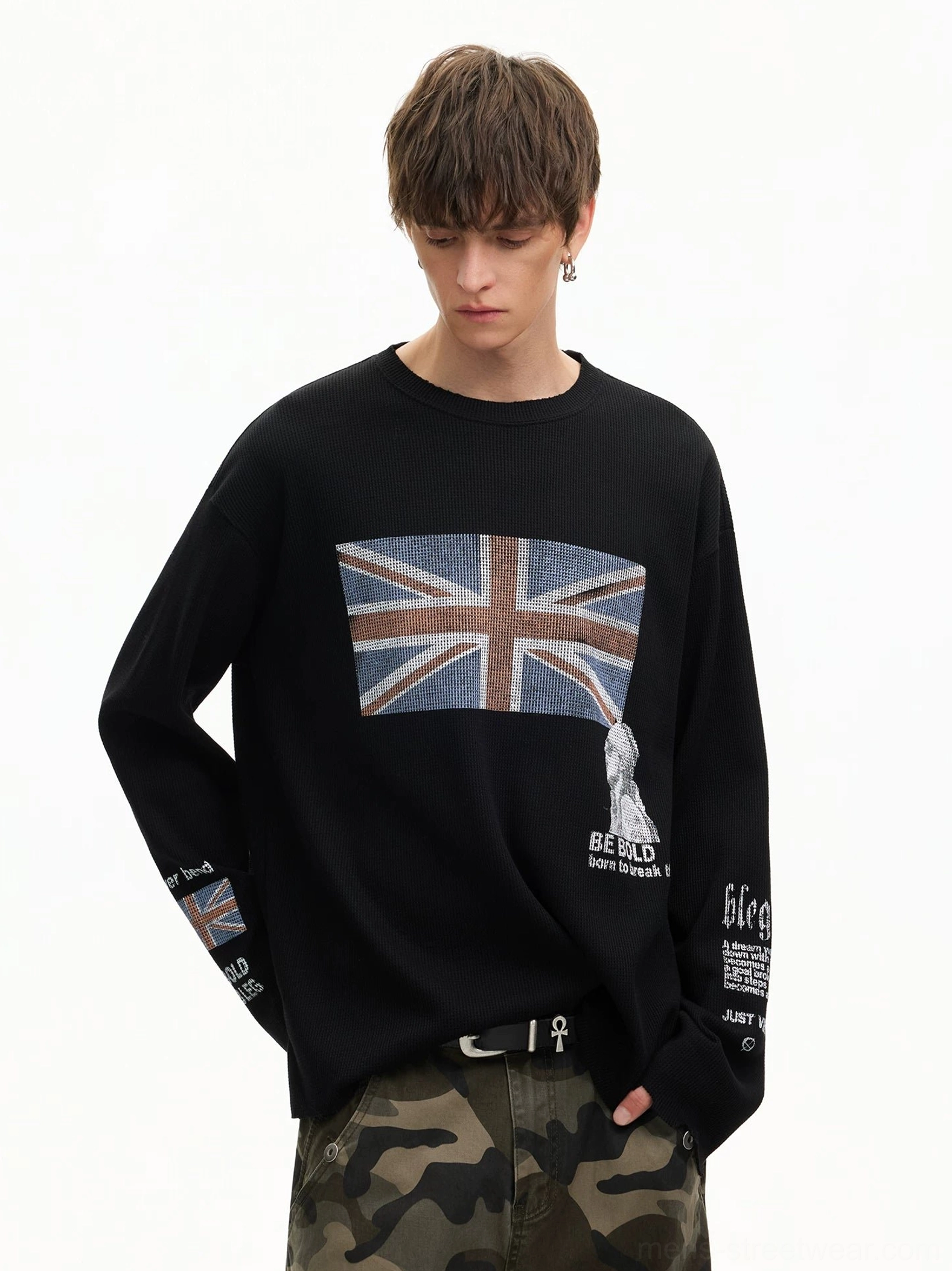 Three-quarter view of black Union Jack printed waffle long sleeve tee with oversized relaxed streetwear silhouette