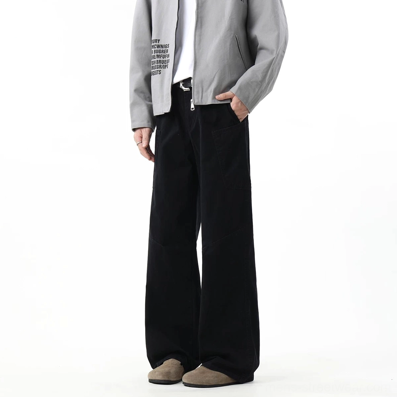 Black utility wide-leg cargo pants with clean tailoring, oversized pockets, and adaptable styling for casual urban outfits