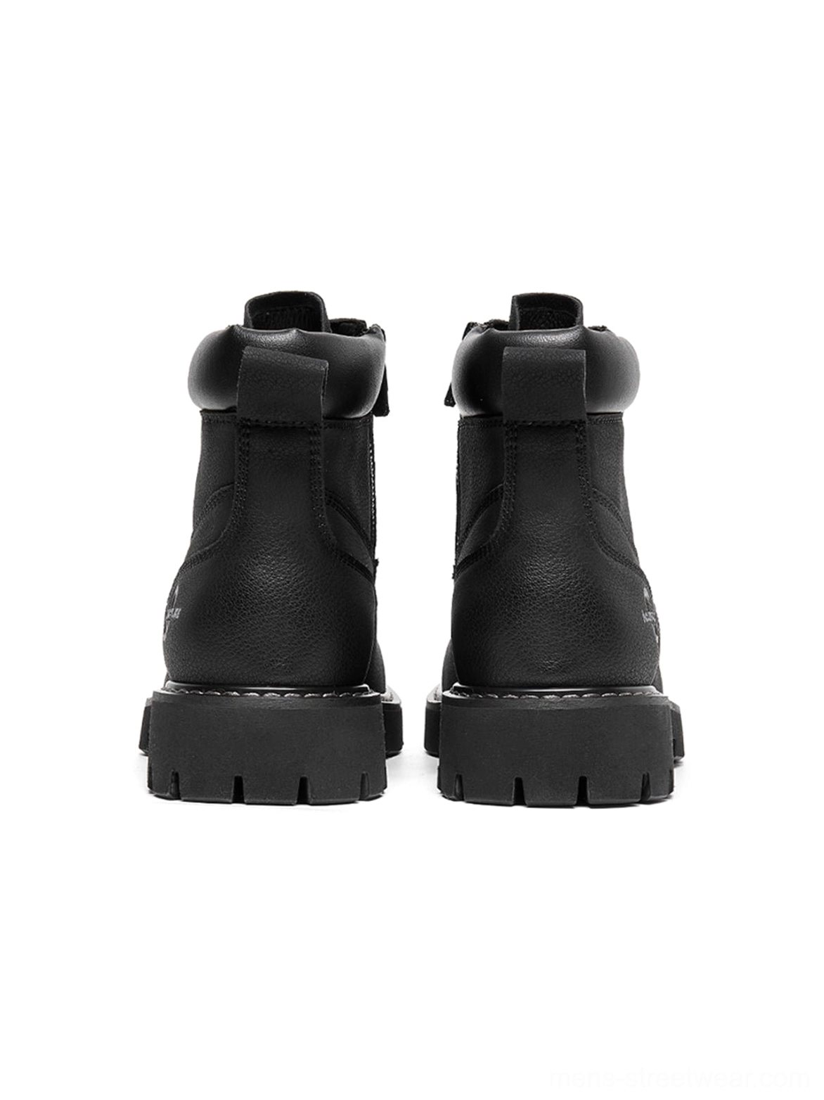 Black utility work ankle boots with bold lug tread and streamlined silhouette for urban fashion