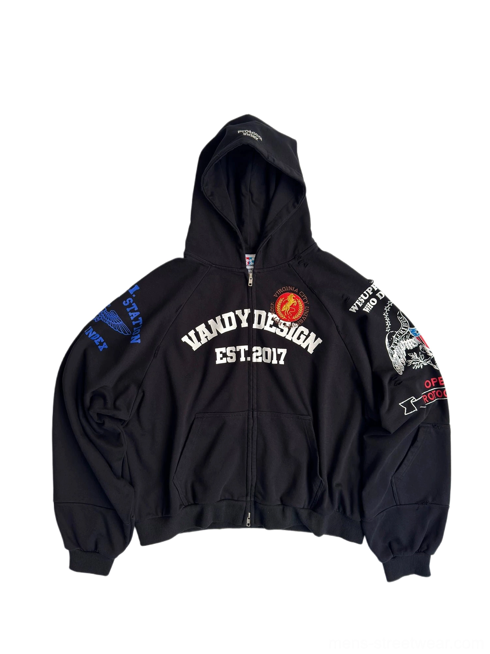 Front view of black oversized varsity crest embroidered zip-up hoodie with chest lettering, red badge, colorful sleeve patches, drawstring hood, and kangaroo pocket